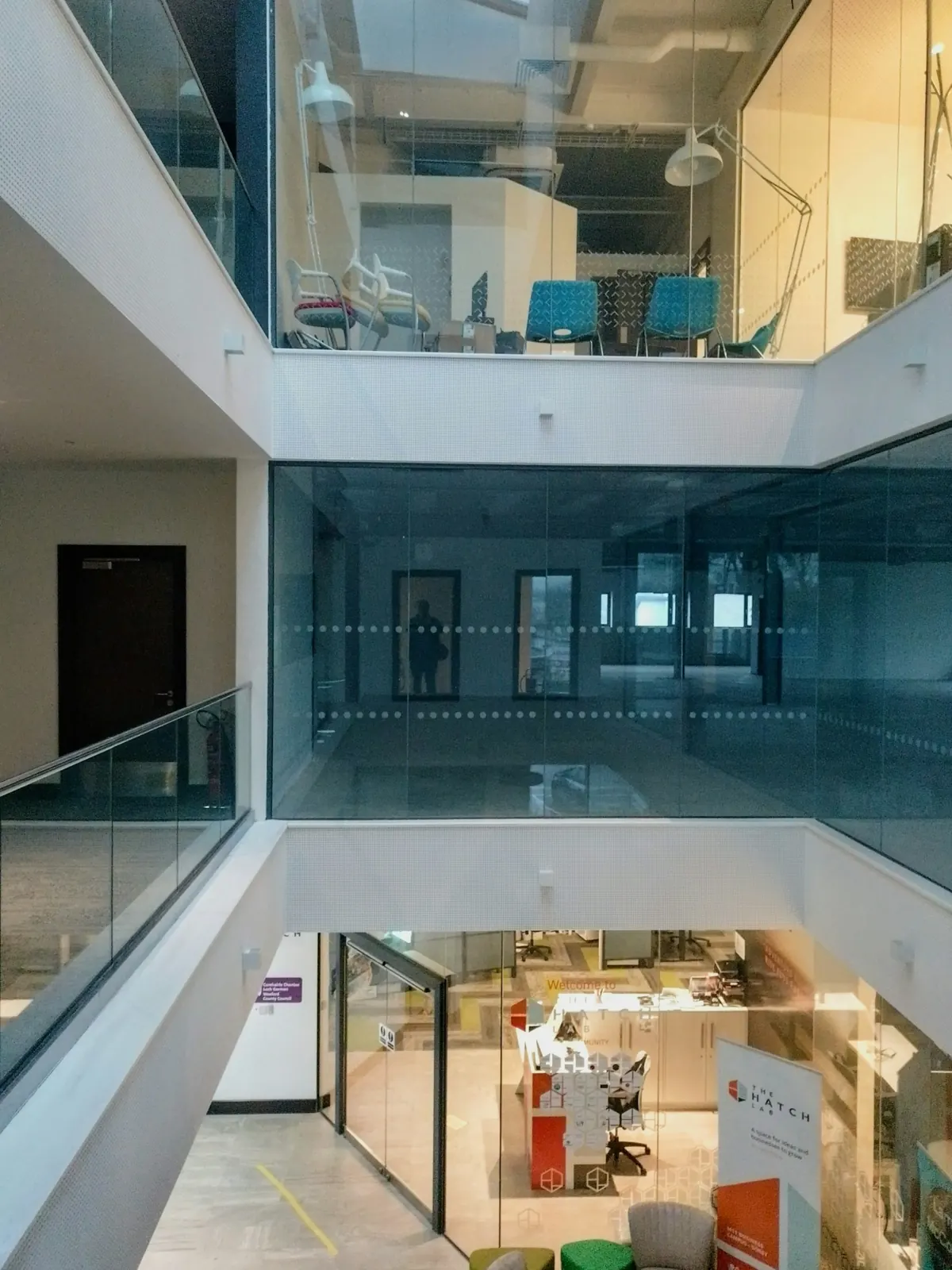Light-filled modern office with layered glass walkways