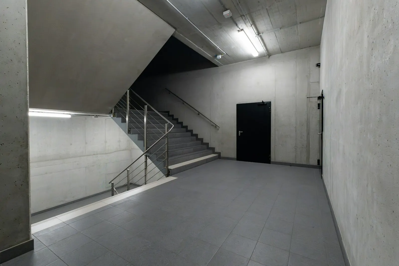 Minimal modern stairway offering multiple directions through a building