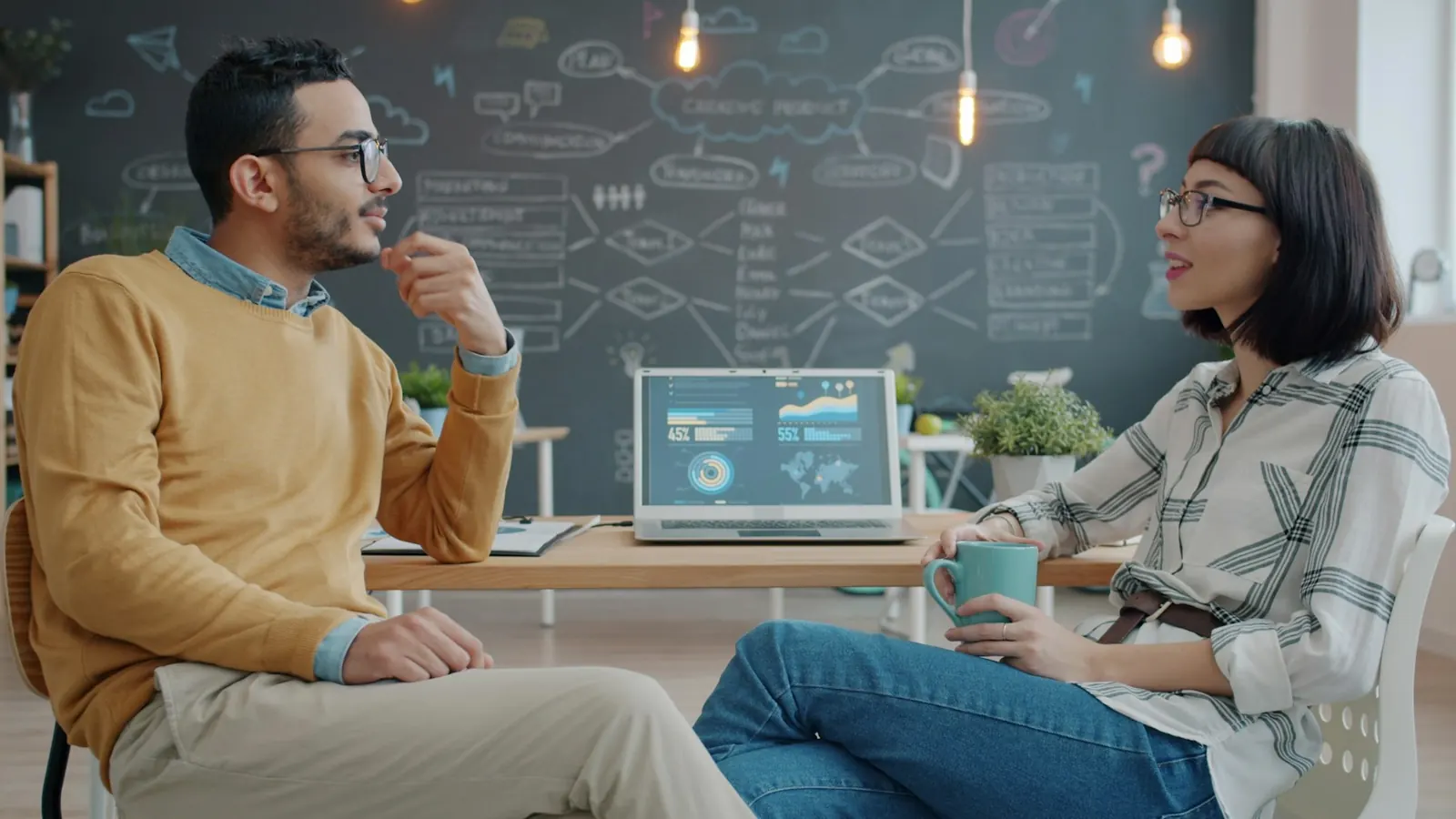 Two colleagues having a thoughtful business conversation
